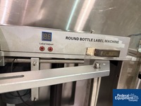 Image of Round Bottle Llabeler 05